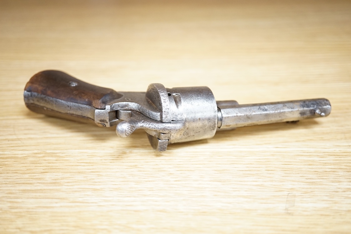 A six shot 7mm Belgian pinfire revolver and another similar, both with folding triggers and wooden grips